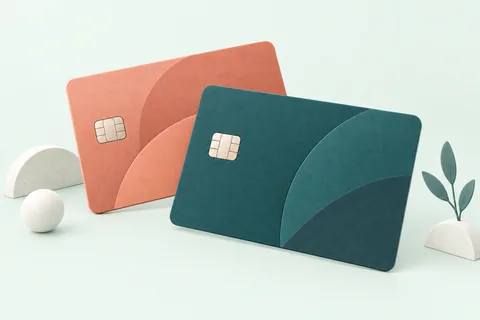 Ilustración de dos tarjetas bancarias genéricas, sin marca, en tonos petróleo y coral.